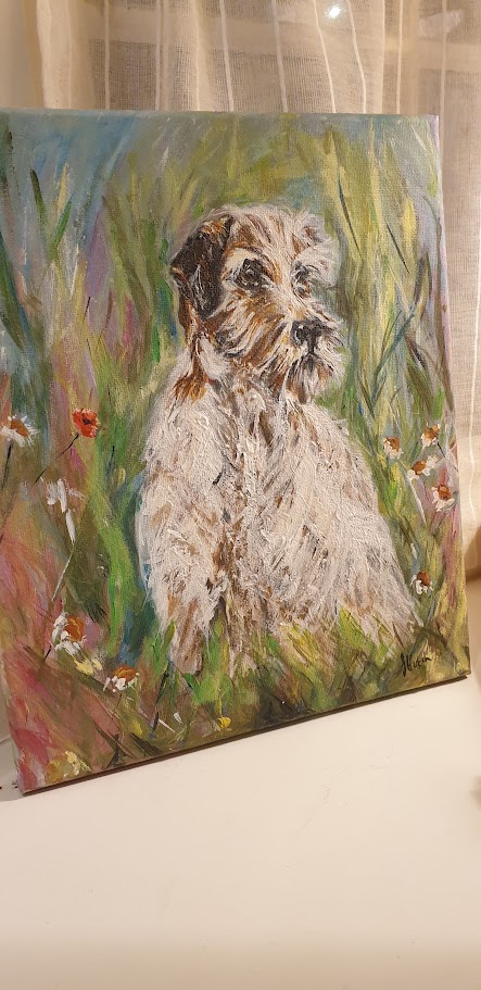 Signed original painting of a scruffy terrier dog standing in a wild green meadow with tiny flowers.